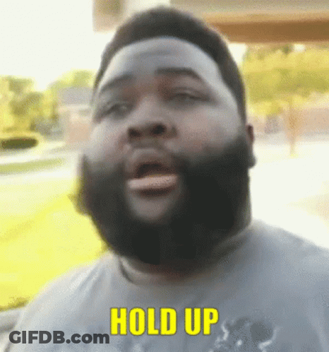 Bearded Man Saying Hold Up In Yellow Letters GIF