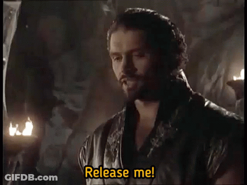 Bearded Man Saying Release Me In Dark Room GIF