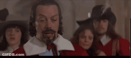 Bearded Man Saying You First To Another Man GIF