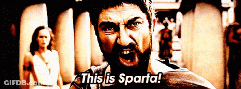 Bearded Man Says This Is Sparta In Front Of Woman GIF