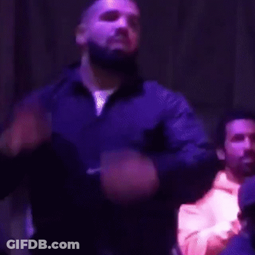 Bearded Man Singing In Dark Room GIF