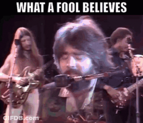 Bearded Man Singing Into Microphone Playing Guitar GIF