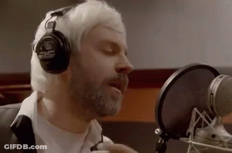 Bearded Man Singing Into Microphone With Headphones GIF