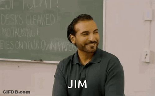 Bearded Man Sitting At Blackboard GIF