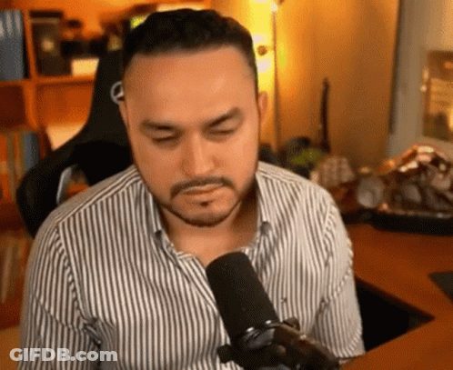 Bearded Man Sitting At Microphone GIF