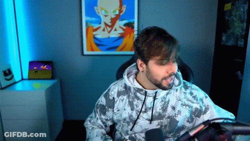Bearded Man Sitting At Microphone GIF