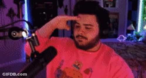 Bearded Man Sitting At Microphone GIF