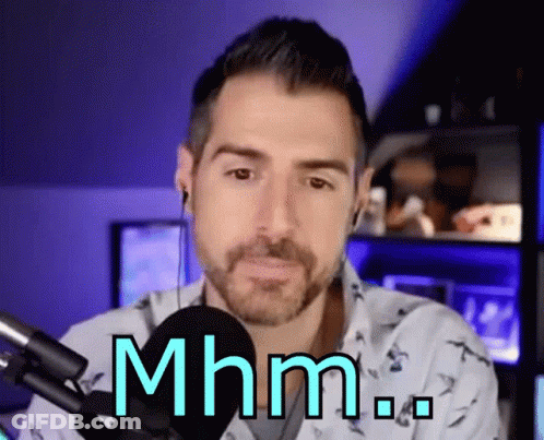 Bearded Man Sitting At Microphone Saying Mhm GIF