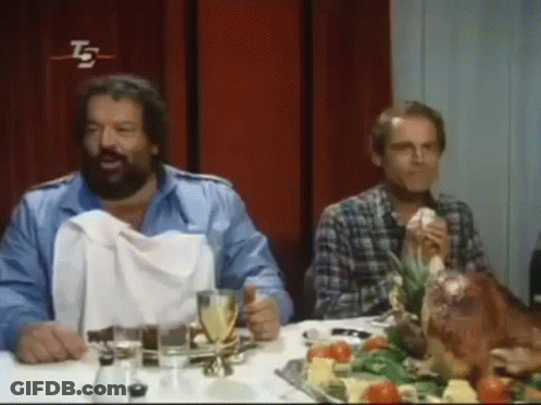 Bearded Man Sitting At Table With Turkey GIF