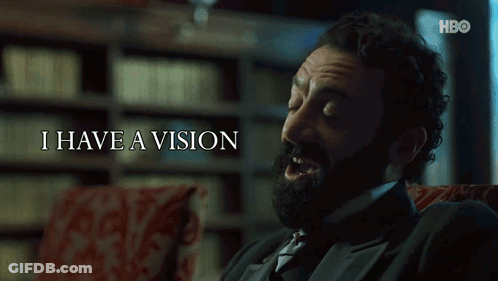 Bearded Man Sitting Before I Have A Vision Sign GIF