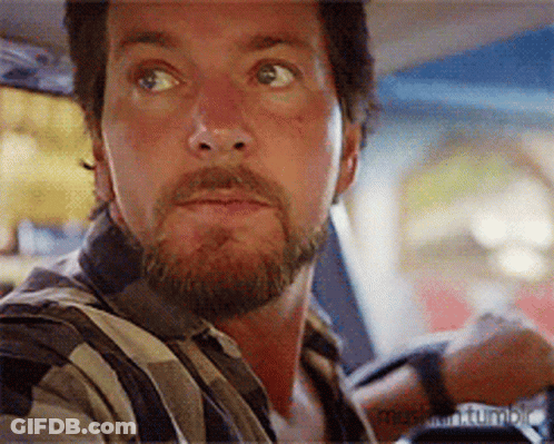 Bearded Man Sitting In Car Looking At Something GIF