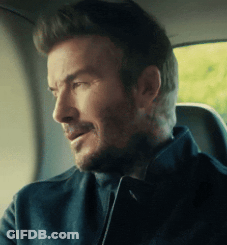 Bearded Man Sitting In Car Looking Out Window GIF