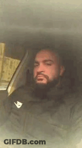 Bearded Man Sitting In Car With Eyes Closed GIF