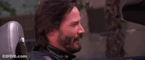 Bearded Man Sitting In Car With Letter H On Seat GIF