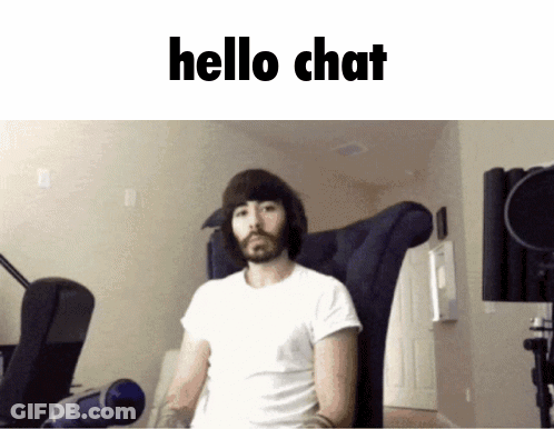 Bearded Man Sitting In Chair Saying Hello Chat GIF