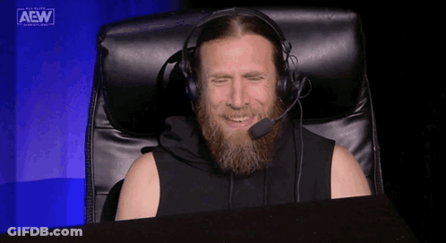 Bearded Man Sitting In Chair With Headphones GIF