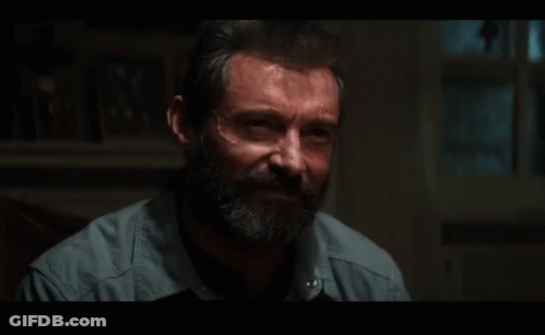Bearded Man Sitting In Dark Room GIF