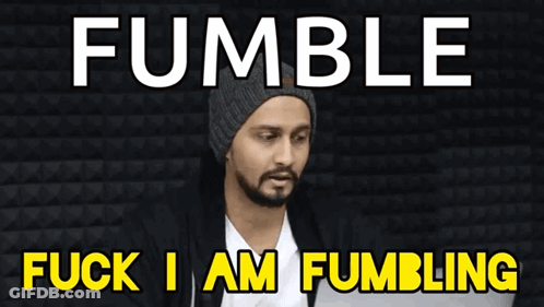 Bearded Man Sitting In Front Of Fumble Fuck Sign GIF