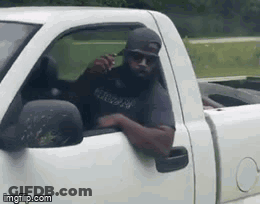 Bearded Man Sitting In White Truck Talking On Cell Phone GIF