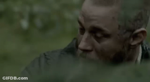 Bearded Man Sitting In Woods Near Waterfall GIF