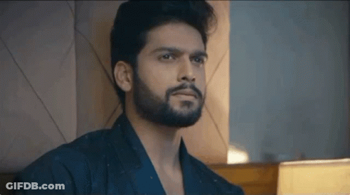 Bearded Man Sitting On Bed GIF