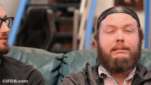 Bearded Man Sitting On Couch Eyes Closed GIF