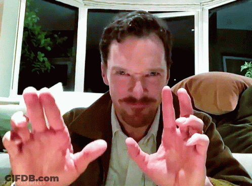 Bearded Man Sitting On Couch Hands Outstretched GIF