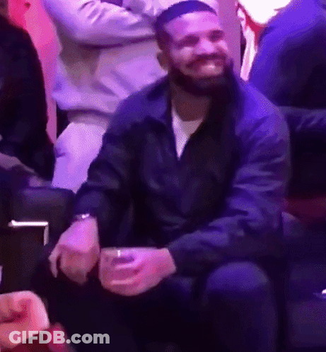 Bearded Man Sitting On Couch Holding Beer GIF