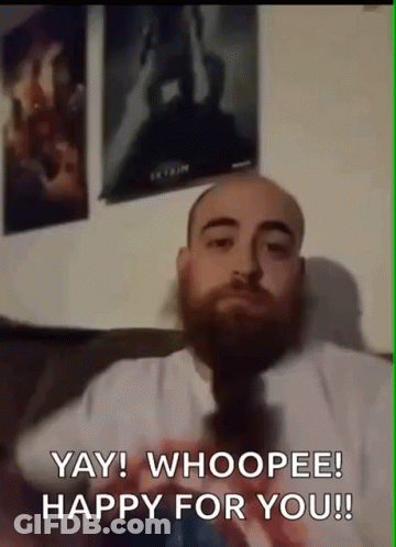 Bearded Man Sitting On Couch Says Yay Whoopee Happy For You GIF