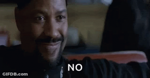 Bearded Man Sitting Smiling Saying No GIF