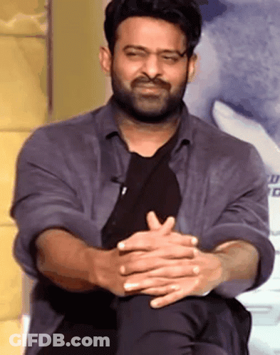 Bearded Man Sitting With Folded Hands GIF