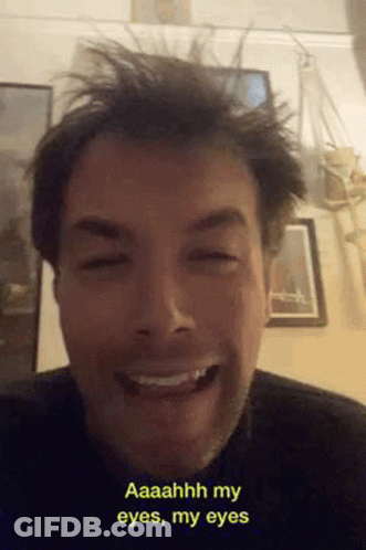 Bearded Man Smiling And Making Funny Face GIF