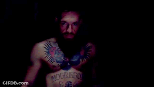 Bearded Man Smiling And Making Funny Face GIF