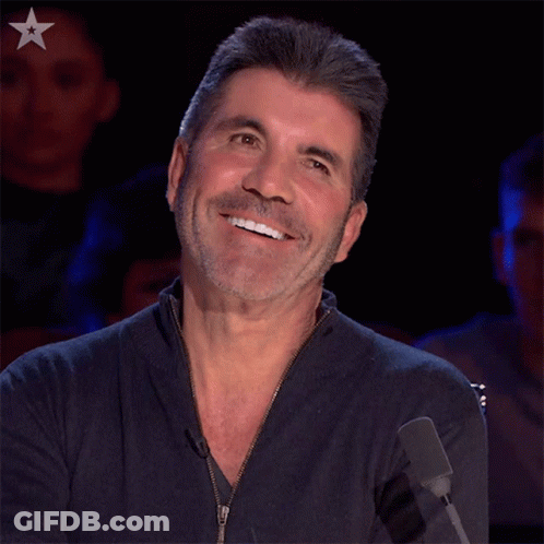 Bearded Man Smiling At Microphone With Star GIF