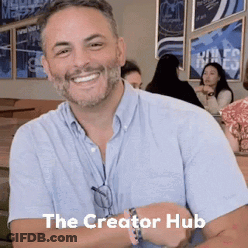 Bearded Man Smiling At Table GIF