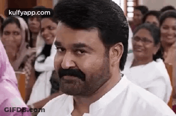 Bearded Man Smiling Before Crowd GIF