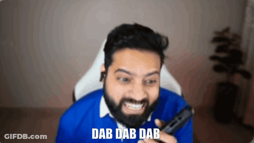 Bearded Man Smiling Holding Remote Saying Dab Dab Dab GIF