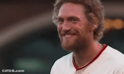 Bearded Man Smiling In Baseball Uniform GIF