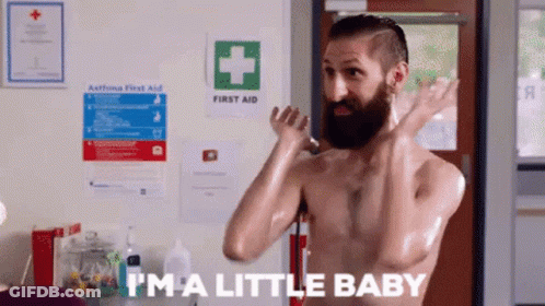 Bearded Man Smiling In Black Vest GIF
