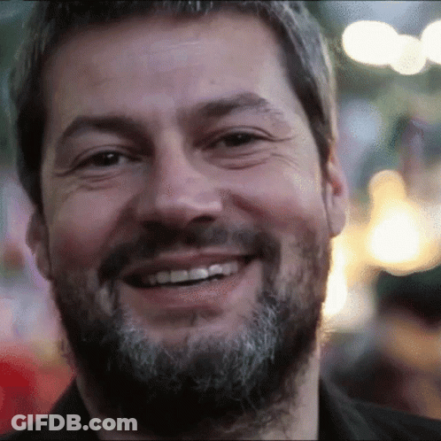 Bearded Man Smiling In Blurry Photo GIF