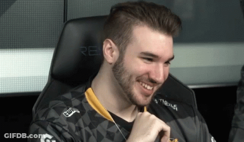 Bearded Man Smiling In Chair Saying Re GIF