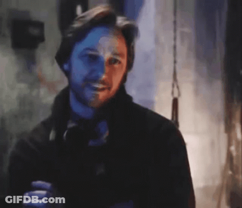 Bearded Man Smiling In Dark Blurry Photo GIF