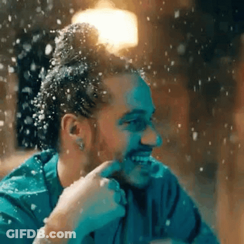 Bearded Man Smiling In Falling Snow GIF