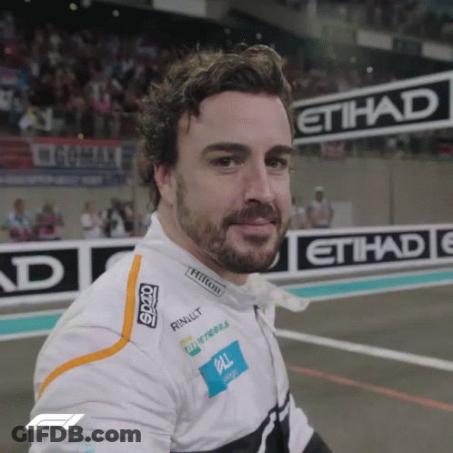 Bearded Man Smiling In Front Of Etihad Sign GIF