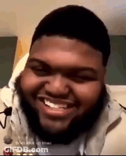 Bearded Man Smiling On Bed GIF