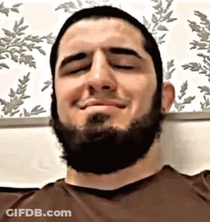 Bearded Man Smiling With Eyes Closed In Brown Shirt GIF