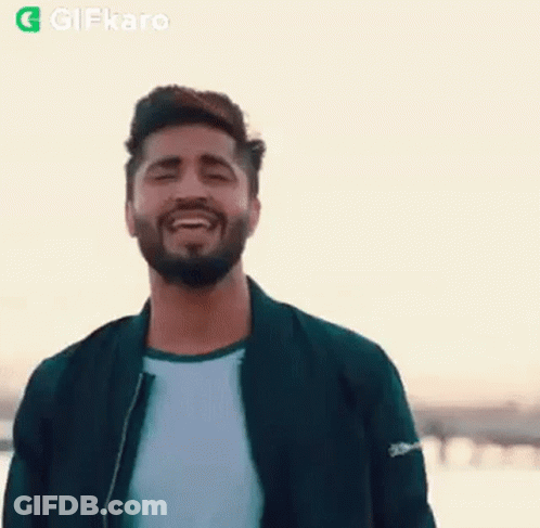 Bearded Man Smiling With Eyes Closed In Jacket GIF