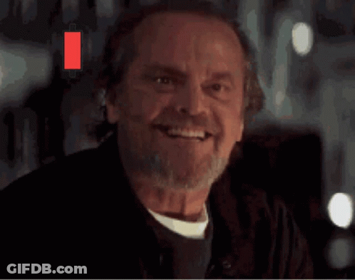 Bearded Man Smiling With Green And Red Candlestick GIF