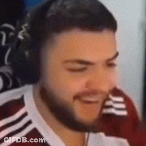 Bearded Man Smiling With Headphones At Computer GIF