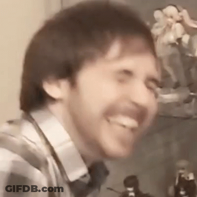 Bearded Man Smiling With Tongue Out GIF